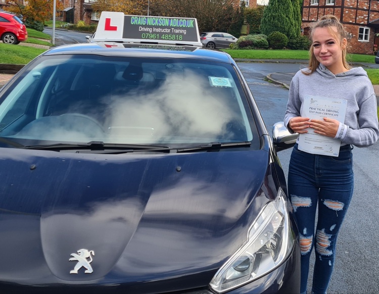 girl with car pass driving test
